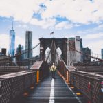man walking on bridge