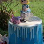 an alice in the wonderland theme birthday cake